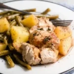 Served plate of one pan chicken potatoes and green beans