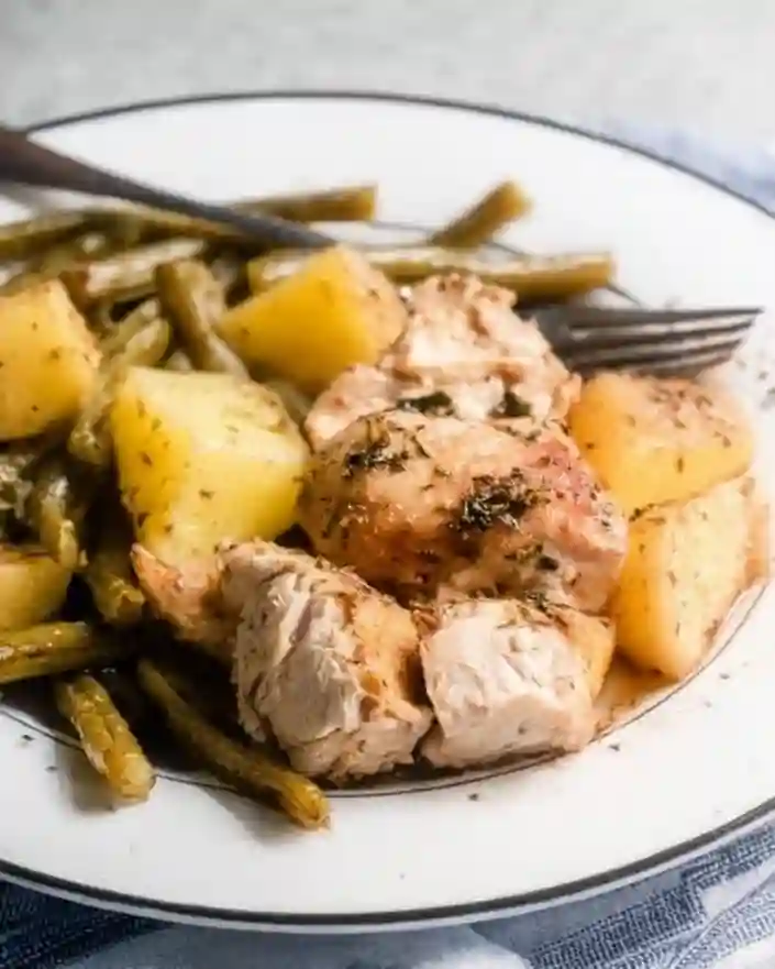 Served plate of one pan chicken potatoes and green beans