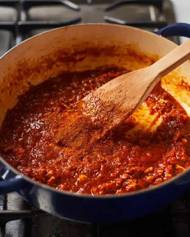 tomato paste and Tex-Mex paste simmering in a pot for black bean soup