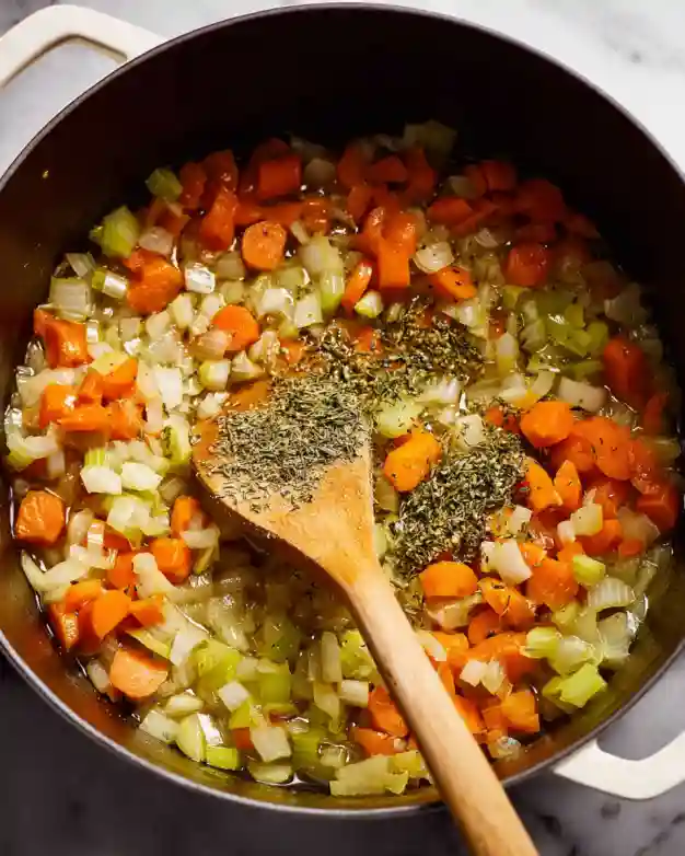 Veggies sautéing in butter for soup base
