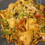 One Pan Chicken with Buttered Noodles Recipe: Combining chicken and noodles in the pan.