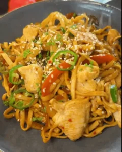 One Pan Chicken with Buttered Noodles Recipe: Combining chicken and noodles in the pan.