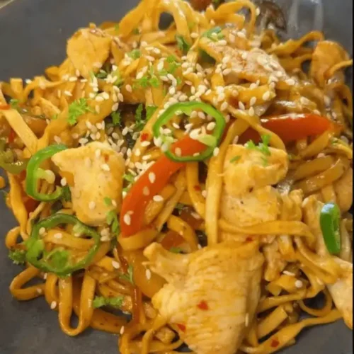 One Pan Chicken with Buttered Noodles Recipe: Combining chicken and noodles in the pan.