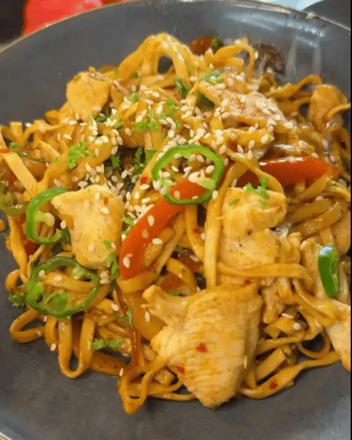 One Pan Chicken with Buttered Noodles Recipe: Combining chicken and noodles in the pan.