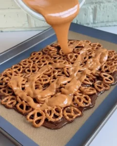 caramel sauce poured over pretzels for no bake caramel pretzel crack bars
