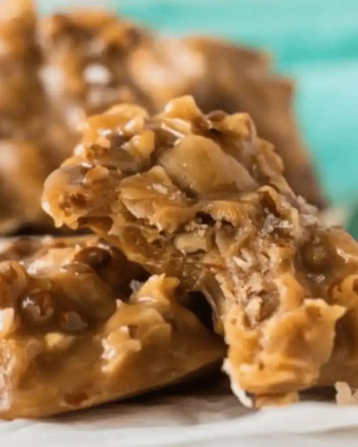 Easy No-Bake Desserts 12 Close-up of chewy no bake coconut pecan praline cookie with a bite taken