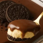 Spoonful of no bake Oreo dessert with cream and chocolate topping