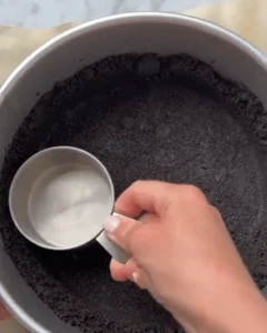 preparing chocolate cookie crust for no-bake double chocolate cheesecake recipe