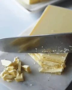 chopping white chocolate for no bake orange creamsicle truffles