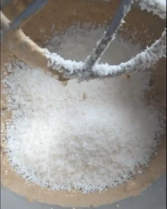 Mixing coconut into no bake moose fart batter