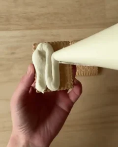 piping cream on biscuit for strawberry shortcake no bake recipe