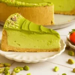 Slice of No Bake Pistachio Cheesecake with pistachio cream topping