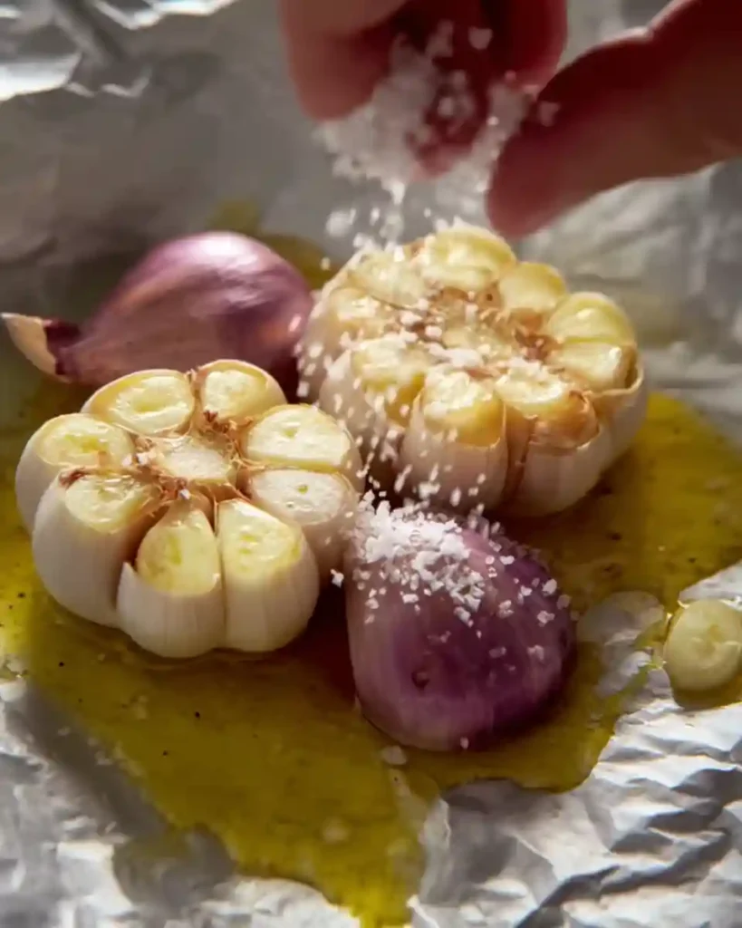 Quick Roasted Garlic Bread 2 Garlic bulbs and shallots seasoned with oil and salt ready for roasting