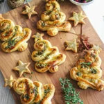Christmas Puff Pastry Trees 2 Baked Christmas puff pastry trees with pesto and cheese on a festive board